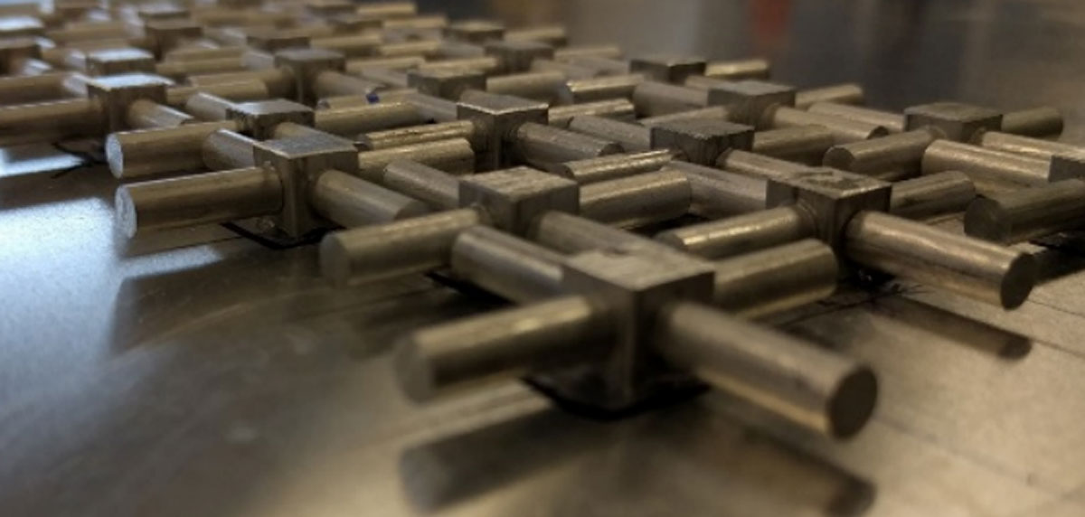 An array of resonators glued on an aluminum plate. Image: Chris Hakoda