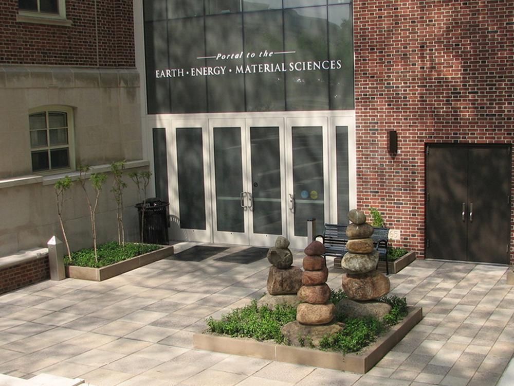 Photo of brick building with glass doors.