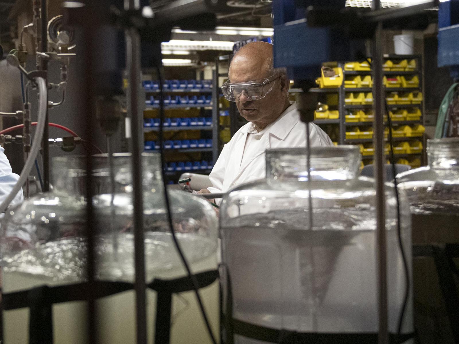 Sarma Pisupati standing in lab